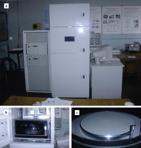 Figure 6. Selective laser sintering installation developed in the Powder Metallurgy Institute.: a – general view; b –working chamber; c –technology platform