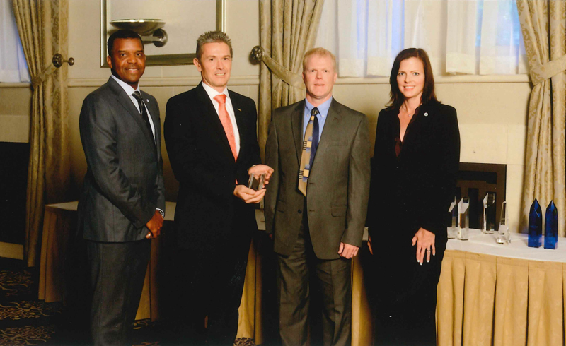 From left to right: Byron Foster, group vice president and general manager, JCI, Thomas Jeworrek and Timothy Laughlin, GKN Sinter Metals, and Kelly Bysouth, group vice president global purchasing, JCI.