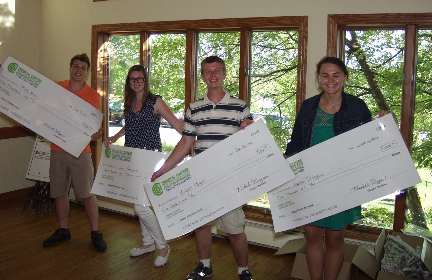 CCAI scholarship recipients receive their checks.