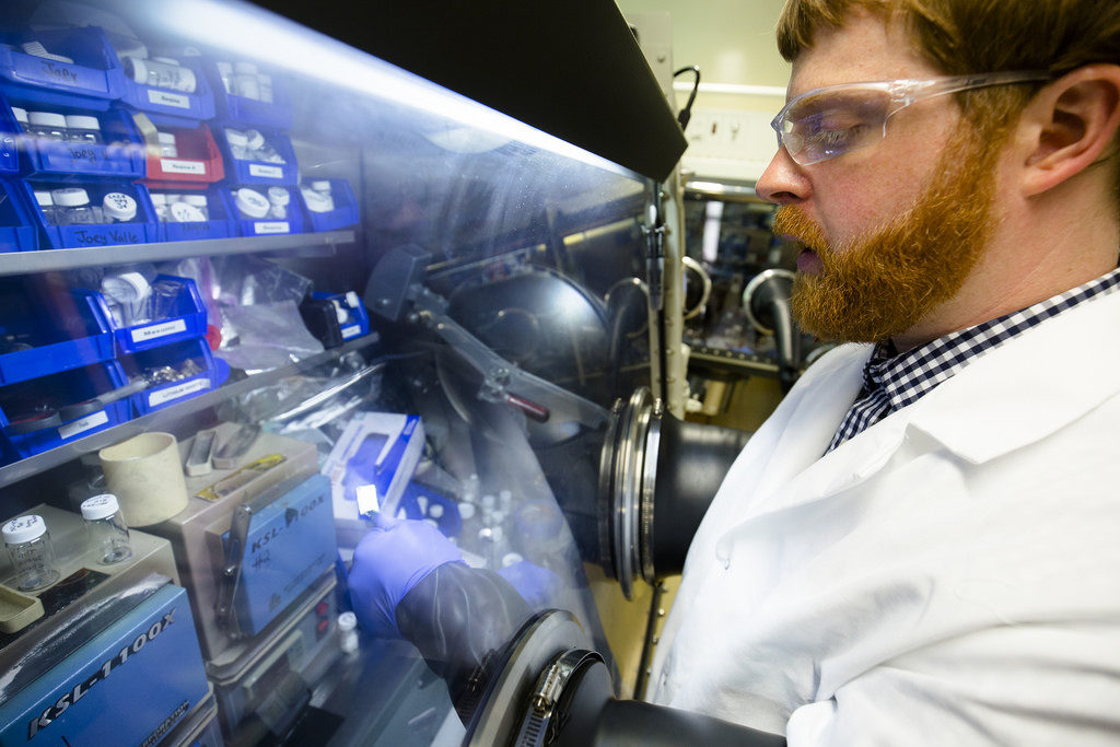 Nathan Taylor, a post-doctoral fellow in mechanical engineering at the University of Michigan, inspects a piece of lithium metal. Photo: Evan Dougherty/Michigan Engineering Communications & Marketing.