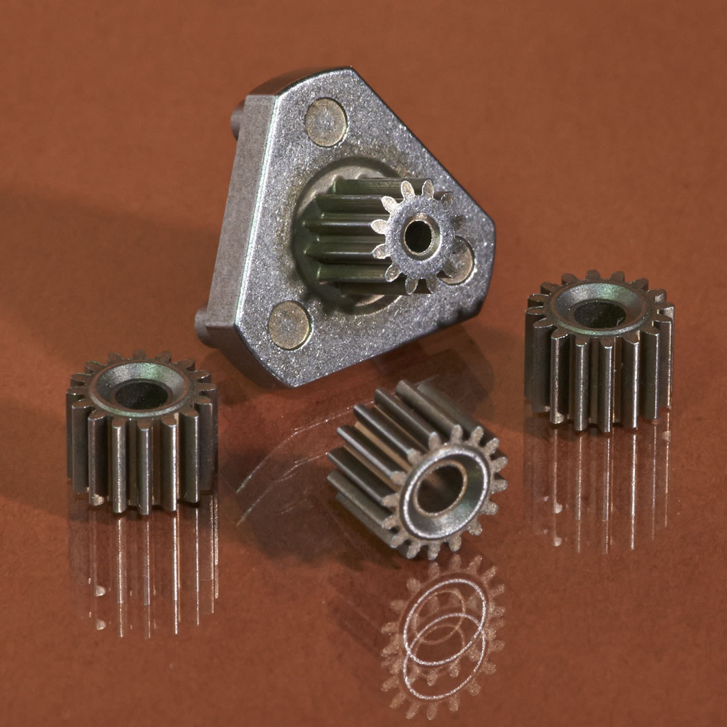 A sinter-hardened steel planetary gear system, featuring a carrier with an integrated sun gear and three planetary gears, earned the Grand Prize in the Medical/Dental Category.