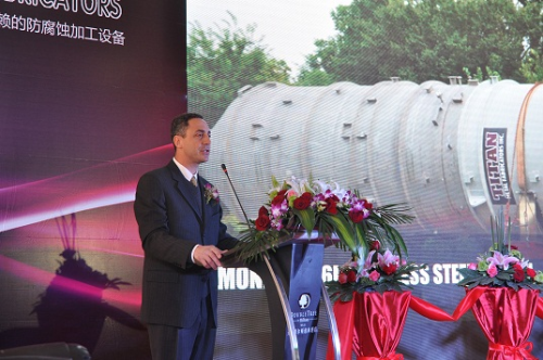 Steven Muscarella addressing the audience of Chemical, Pharmaceutical, and Process Industry Professionals during the Grand Opening ceremony of TITAN Metal Fabricators (Wuxi) Co., Ltd.  One TITAN’s custom designed reactive metal fabrications is pictured in the background.