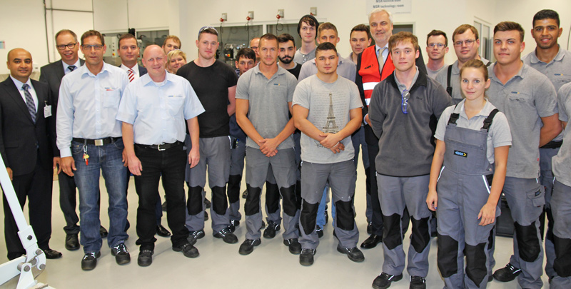 Garrelt Duin with apprentices and the GKN Management team at the GKN Sinter Metals plant.