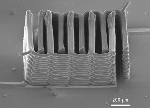 This image shows the interlaced stack of electrodes that were printed layer by layer to create the working anode and cathode of a microbattery. (SEM image courtesy of Jennifer A. Lewis.)