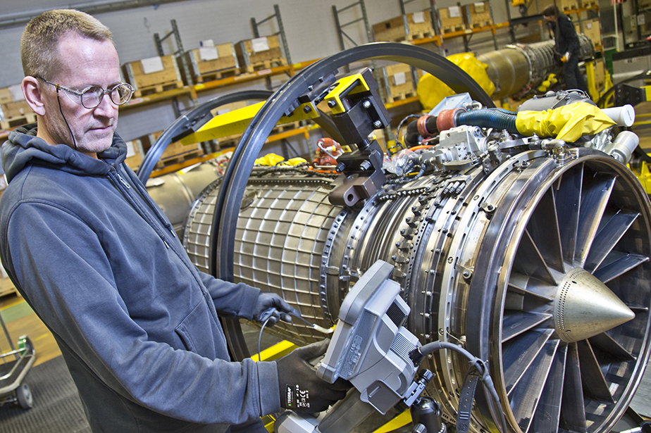 A RM12 Engine engineer performing boroscope testing on the fan/compressor blades.