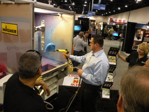 Spray equipment demonstrations at the Wagner Industrial Systems booth.