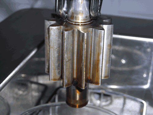 Figure 1A: Ultrasonic cleaning removes lubricants rapidly. In this demonstration, most of the soil is removed within the first 30 seconds. Seen here, an oily part after 1-minute immersion in cleaning solution, ultrasonics off. Result: little soil removed. (Images courtesy of BFK Solutions LLC; David Kanegsberg, photographer)