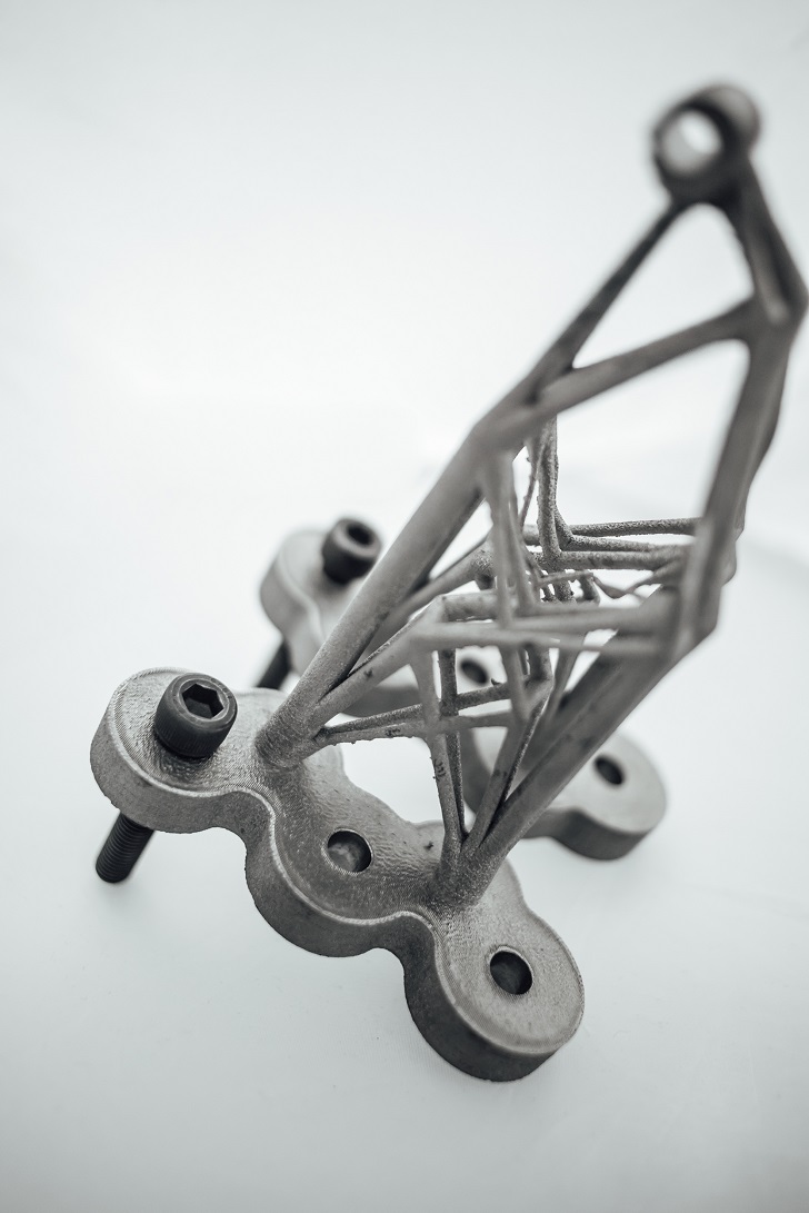 Additive manufacturing offers great design freedom with the ability to produce complex shapes and features. Structures can be optimised to provide the required strength while reducing weight to a minimum. Material: Titanium alloy (Ti-6Al-A1-4V). Process: Electron Beam Melting (EBM).