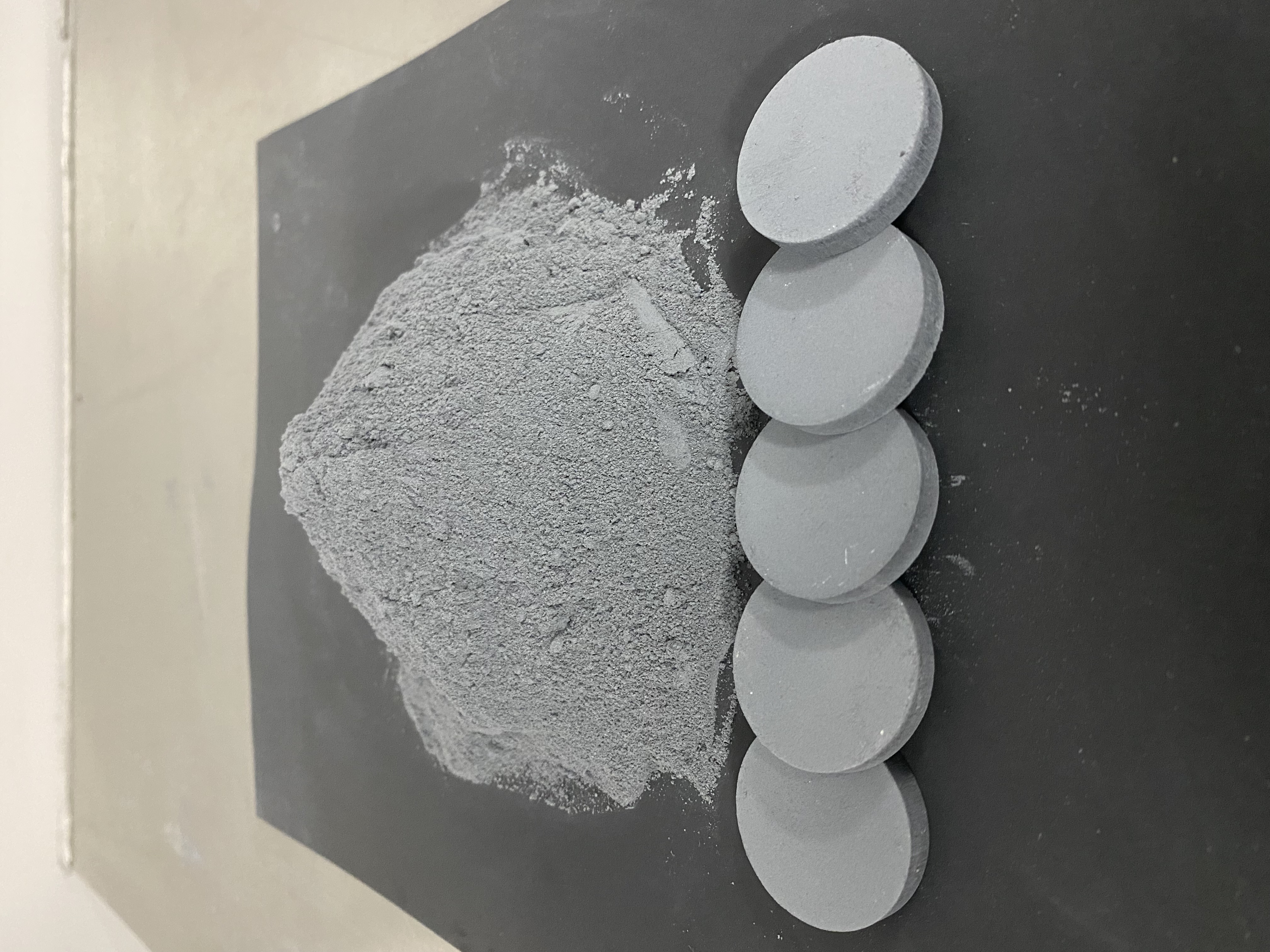 A sample of Metalysis' metal powder, pressed into discs.