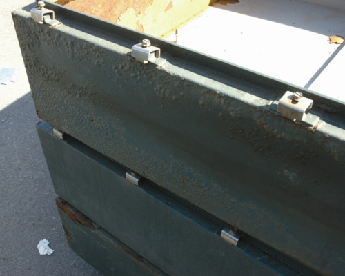Figure 1: Blisters on the external surface of a hinged steel box.