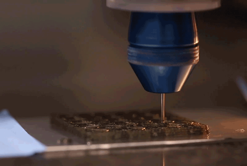 This shows rotational 3D printing in action, controlling the arrangement of embedded fibers in polymer matrices by precisely choreographing the speed and rotation of a 3D printer nozzle. Image: Brett Compton/SEAS.