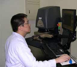 Stream Chung, PhD, regional senior application manager, adjusts the laser profiler that is housed at the Enthone Semiconductor Applications Center in Taiwan.