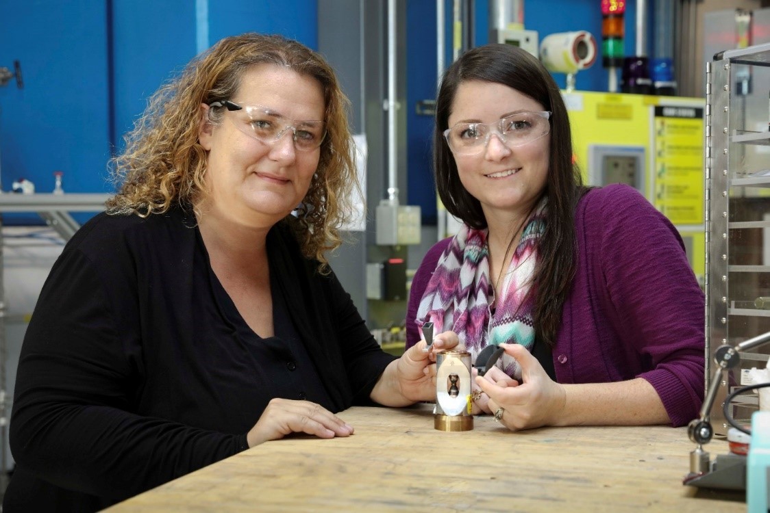 Bianca Haberl (left) and Amy Elliott, co-inventors of the process. (Photo courtesy Genevieve Martin/Oak Ridge National Laboratory, US Dept. of Energy.)