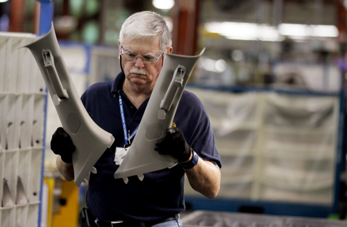 General Motors employee Ray Smith works on sub-assembly of A-pillars for the Chevrolet Traverse at the GM Spring Hill plant in Tennessee.