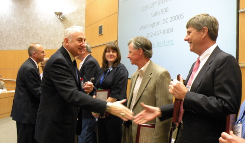 Michael Siegmund (far left), NASF president, and Mike Kelly (second from left), ASKO Processing, congratulate NASF award recipients during a special ceremony at SUR/FIN 2009 this past June.