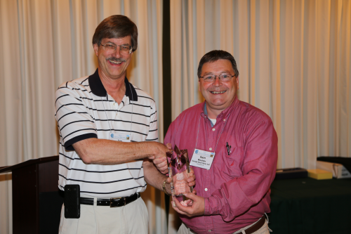 Sam Woehler (right), CCAI National president, congratulates Jim Docken, DuBois Chemicals, who was honored with the 2013 CCAI James F. Wright Lifetime Achievement Award.