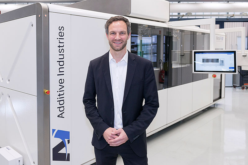 Simon Hoeges, GKN AM director, in front of the MetalFAB1. Photo courtesy GKN Sinter Metals/Photographer/Ralf Bille.