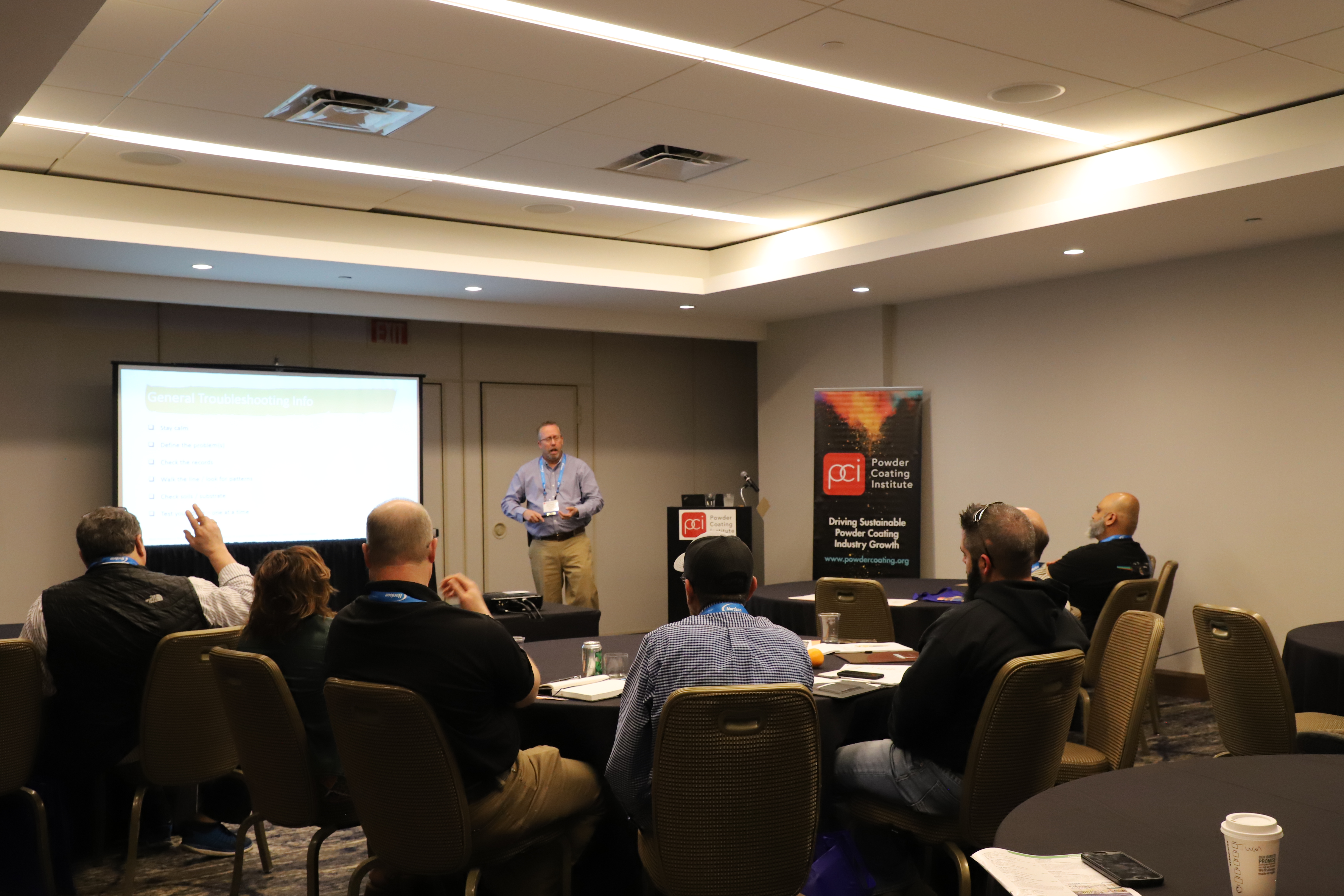 Attendees gain information from speakers that could help improve their custom coater business.