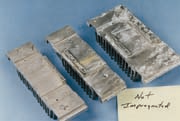 Figure 4b
Figure 4a and 4b: Typical results for impregnated vs. un-impregnated anodized aluminum heat sinks. [Photos courtesy of Anoplate Corporation, Syracuse, N.Y.]
