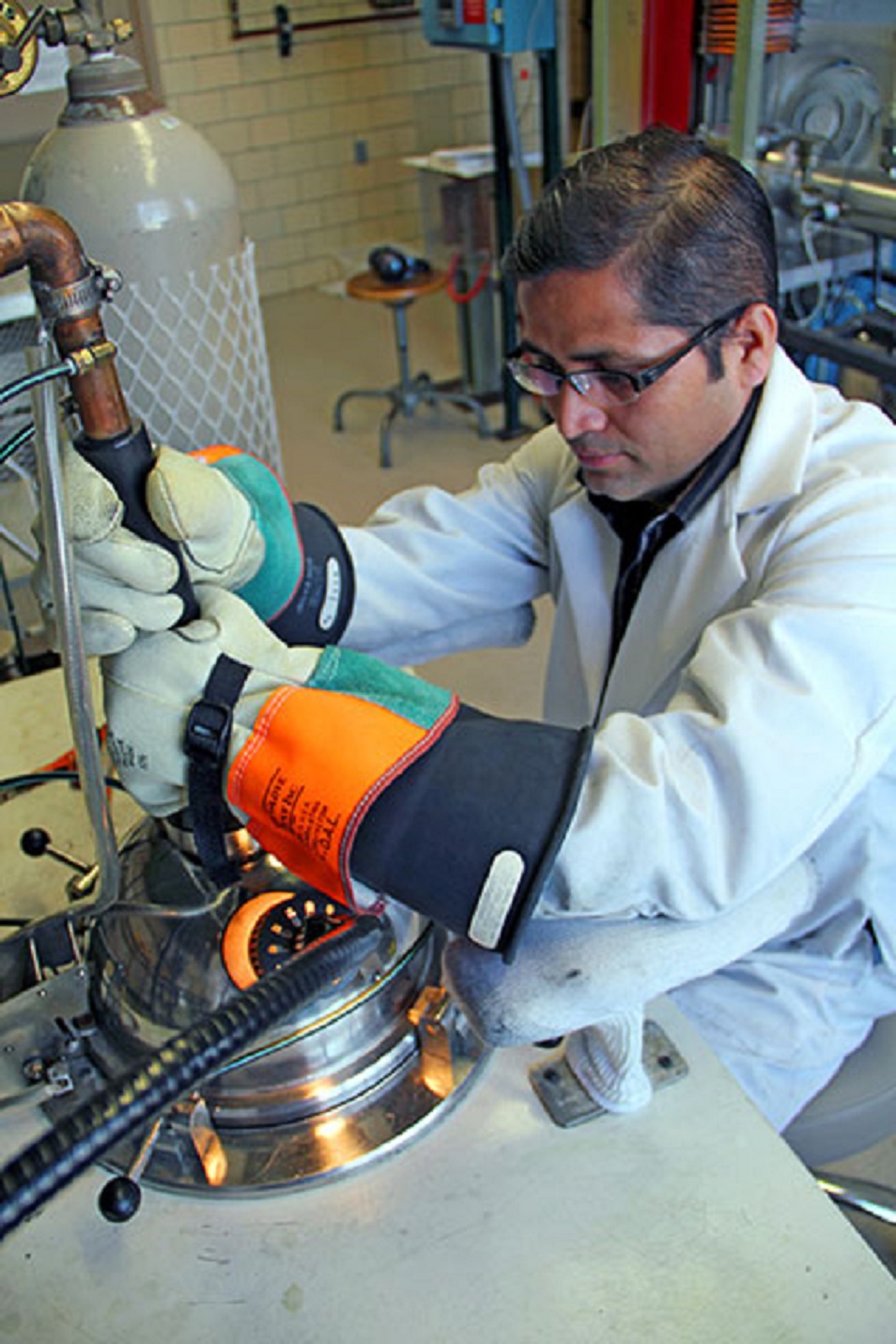 Scientist Arjun Pathak arc melts material in preparation for producing a new type of magnet.