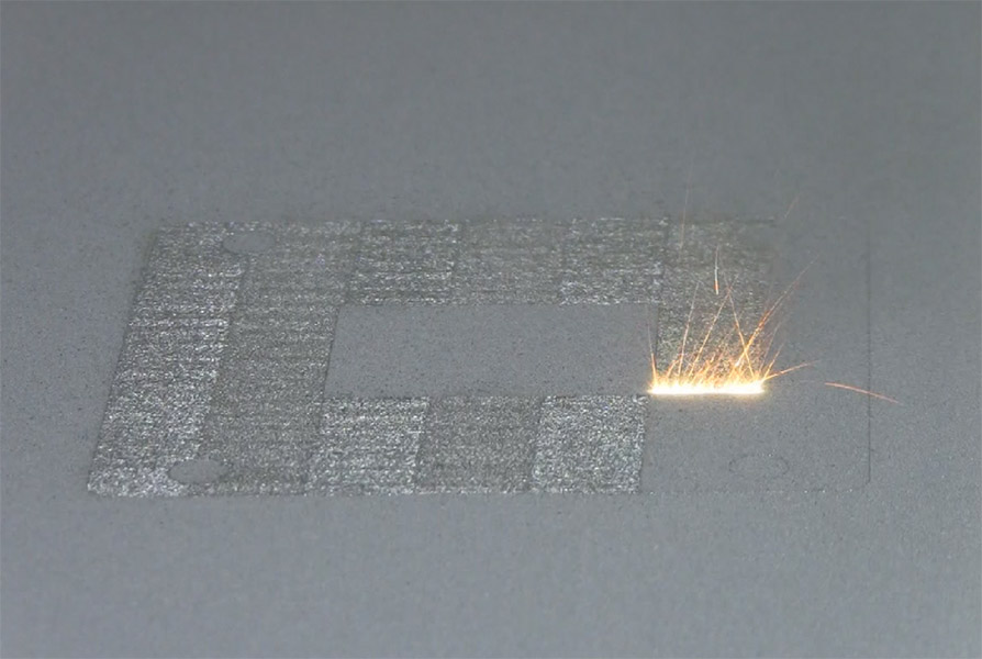 A high-power laser spot scans back and forth over a layer of cobalt-chrome powder on NIST's powder bed fusion additive manufacturing machine. Photo credit: Lane/NIST.
