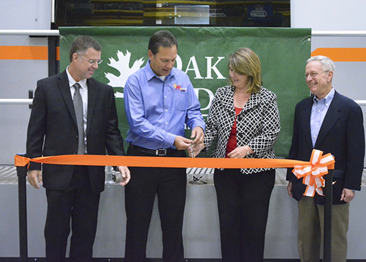 Aerojet Rocketdyne’s Jeff Haynes, Air Force Research Laboratory engineer John Kleek, the University of Tennessee’s Stacey Patterson and Oak Ridge National Laboratory’s Alan Liby celebrate the opening of a high-end laser used in additive manufacturing.